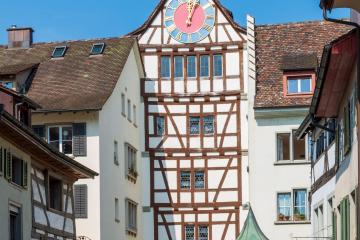 Explore the picturesque clock tower and timbered buildings of Stein am Rhein, a Swiss medieval gem.