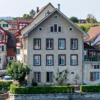 Picturesque historic house by the river in Stein am Rhein, Switzerland, with scenic architecture.
