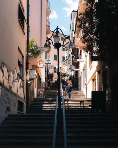 Discover a picturesque stairway in Lugano's charming cityscape, perfect for urban exploration.